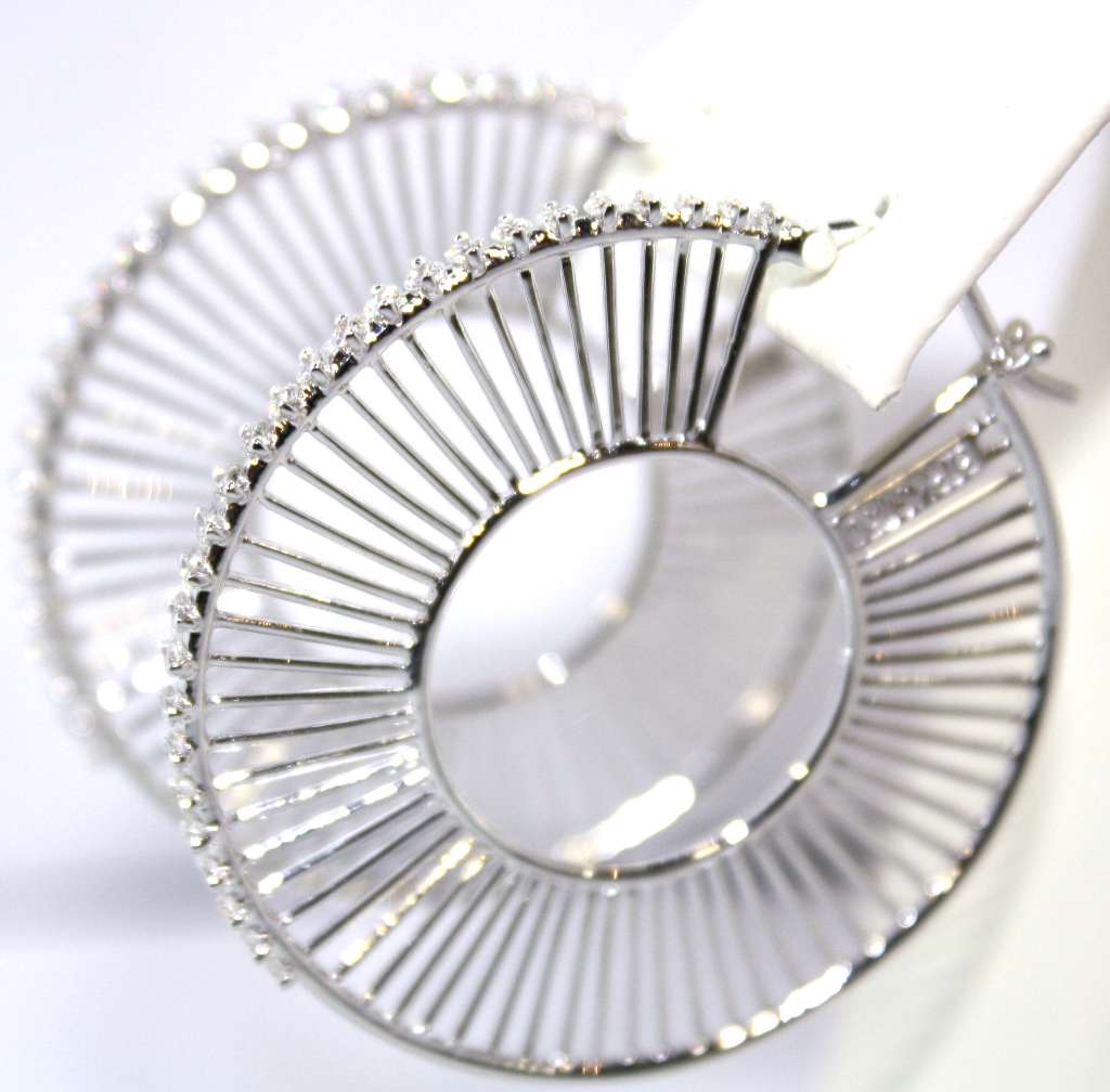 Close-up of 18kt white gold diamond hoop earring showing sparkling 54 round brilliant cut diamonds