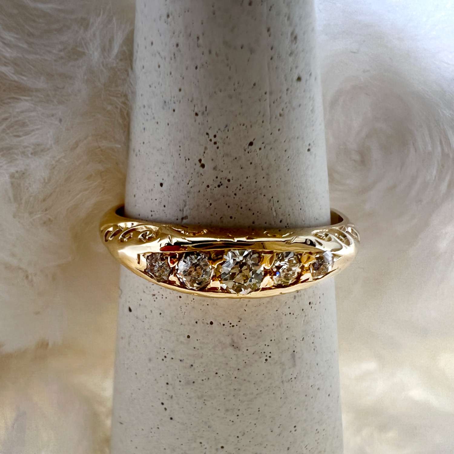 18kt yellow gold diamond band showing side profile with 5 round old mine cut diamonds, ring size 6.25