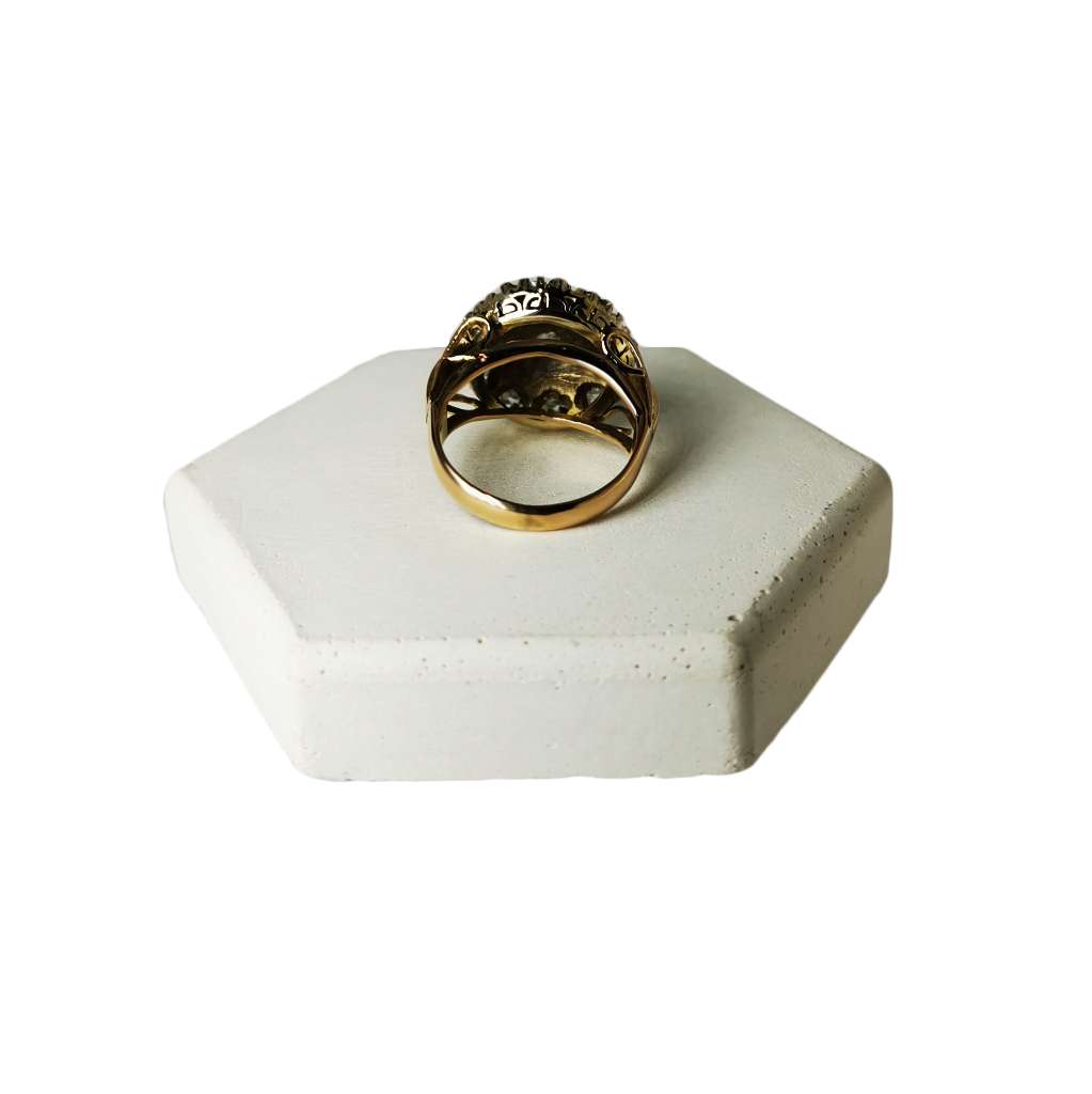 Detailed view of vintage 9kt rose gold and sterling silver ring showing old rose cut diamonds and intricate metalwork