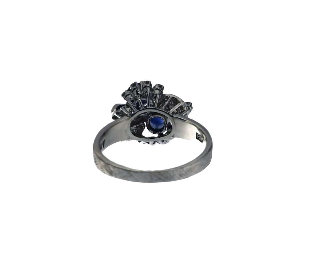 Elegant 40% silver blue sapphire and diamond ring displayed on white background highlighting gemstone shine