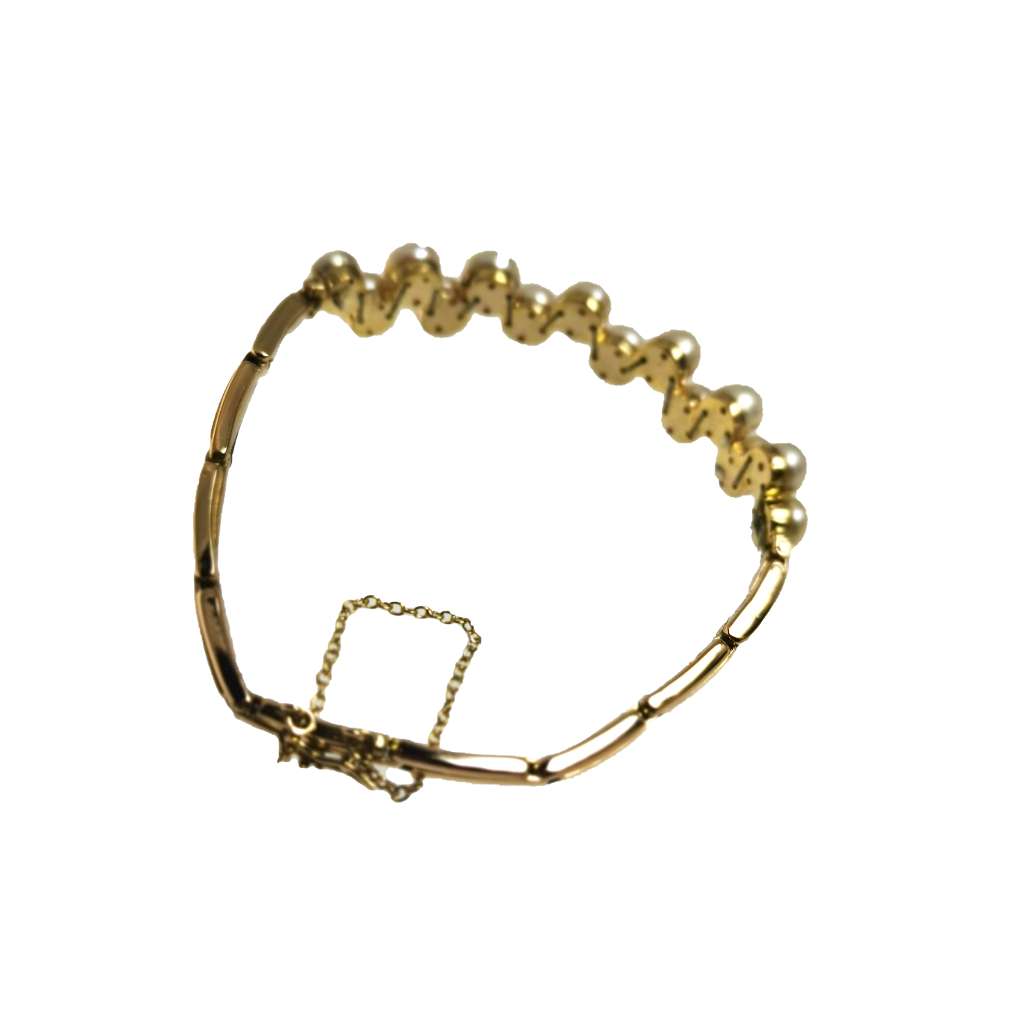 Top view of vintage 15kt yellow gold bracelet featuring fourteen lustrous freshwater pearls and secure clasp