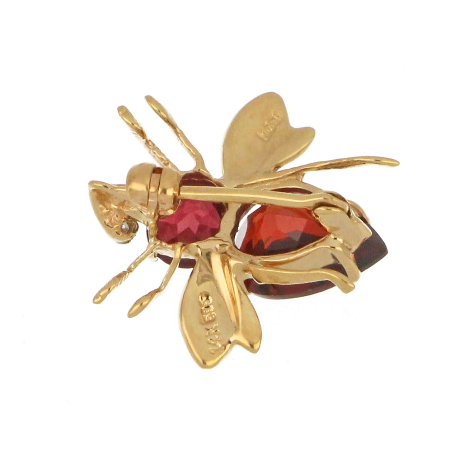 Side view of 14kt yellow gold fly style garnet brooch highlighting craftsmanship and clasp detail