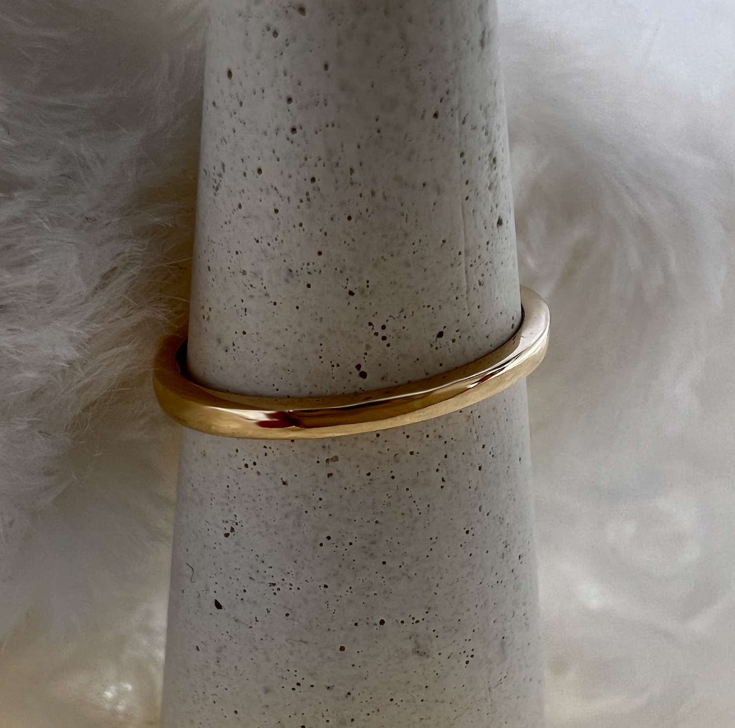 Side profile of elegant 14kt yellow gold ring with four round diamonds totaling 0.50carat set in claw mountings
