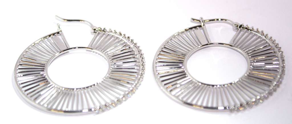 Pair of 18kt white gold diamond hoop earrings displayed on white background showcasing total weight and brilliance