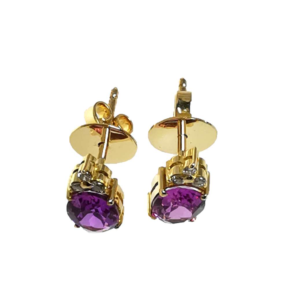 Pair of 12kt yellow gold earrings featuring oval synthetic pink sapphires and small diamonds, top view