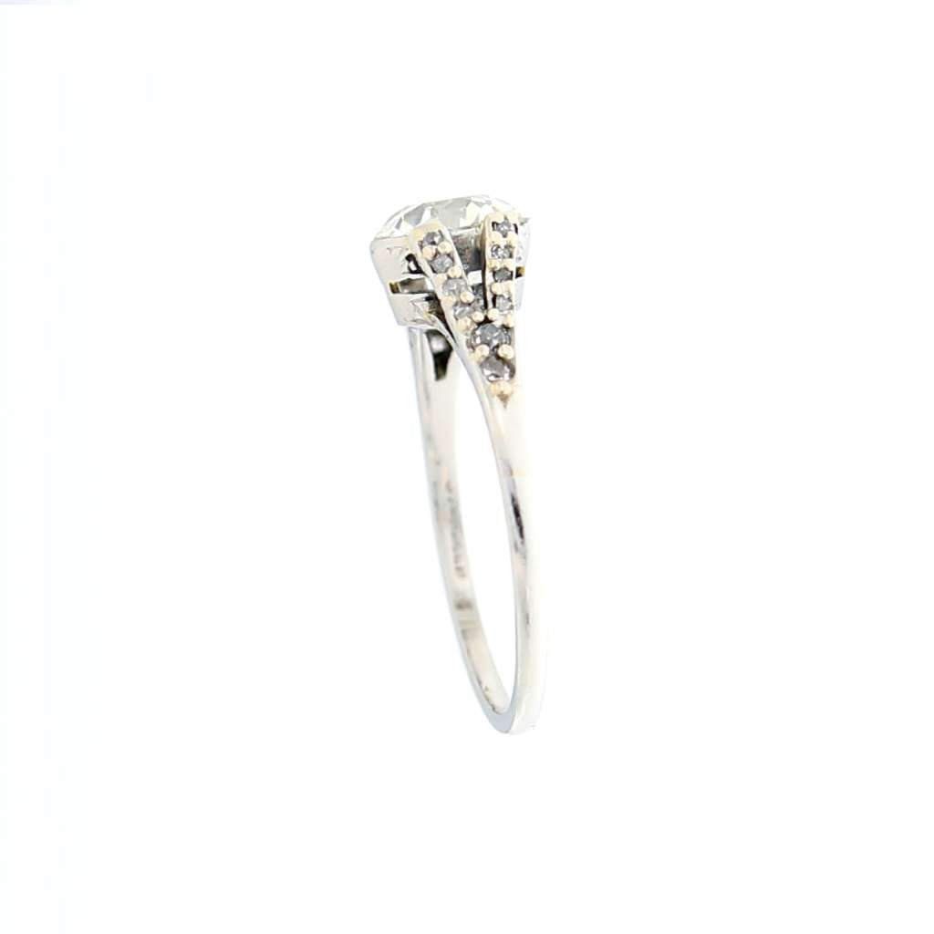 Detailed angle focusing on the platinum band and arrangement of sparkling diamonds in collectible ring
