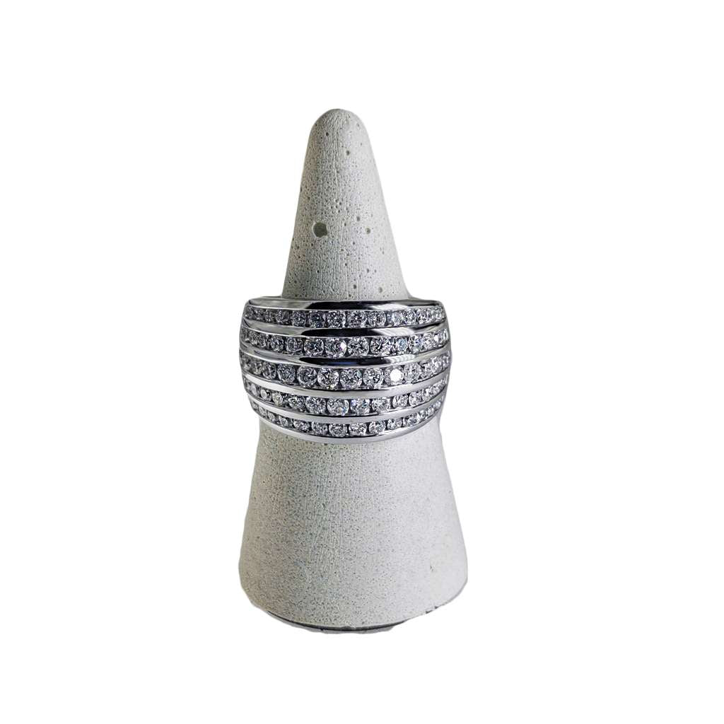 10kt white gold diamond band ring featuring 74 round brilliant cut diamonds in channel setting, angled top view showing sparkle