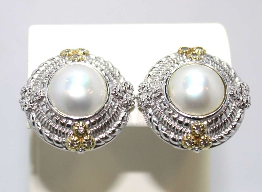 Sterling silver and 18kt yellow gold pearl stud earrings front view showing white 10mm mabe pearls and round brilliant cut diamonds