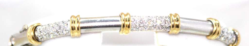 Close-up of 18kt white and yellow gold bracelet featuring 91 round brilliant-cut diamonds totaling 1.95 carats, showcasing dual-tone metal and diamond sparkle