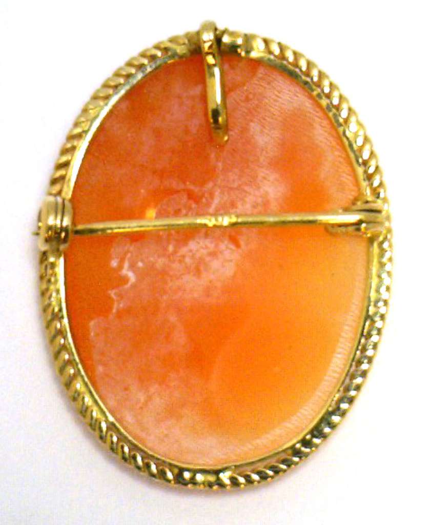 Side angle of 14kt yellow gold cameo brooch pendant showing gold frame and profile of shell cameo