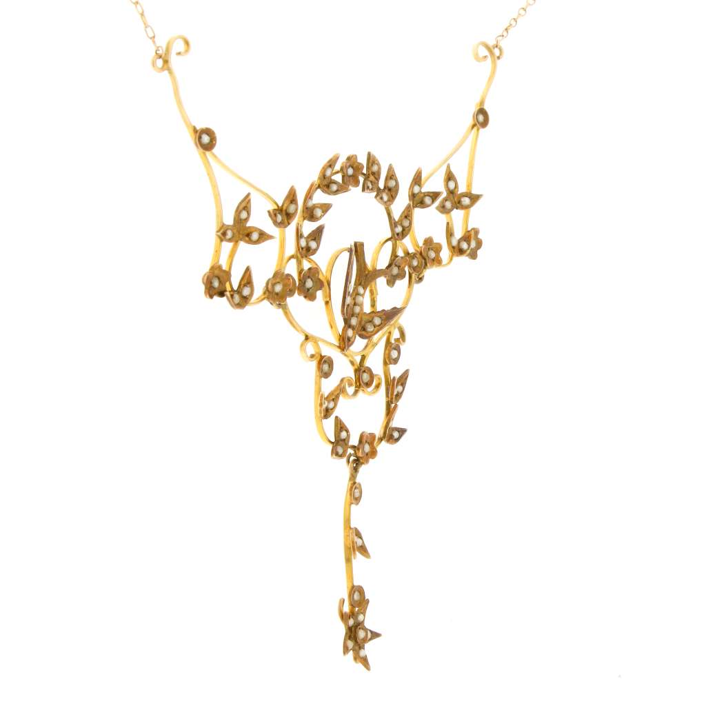 Detailed side angle of 14kt yellow gold necklace with 68 seed pearls in bird and floral design, lightweight 6.72 grams
