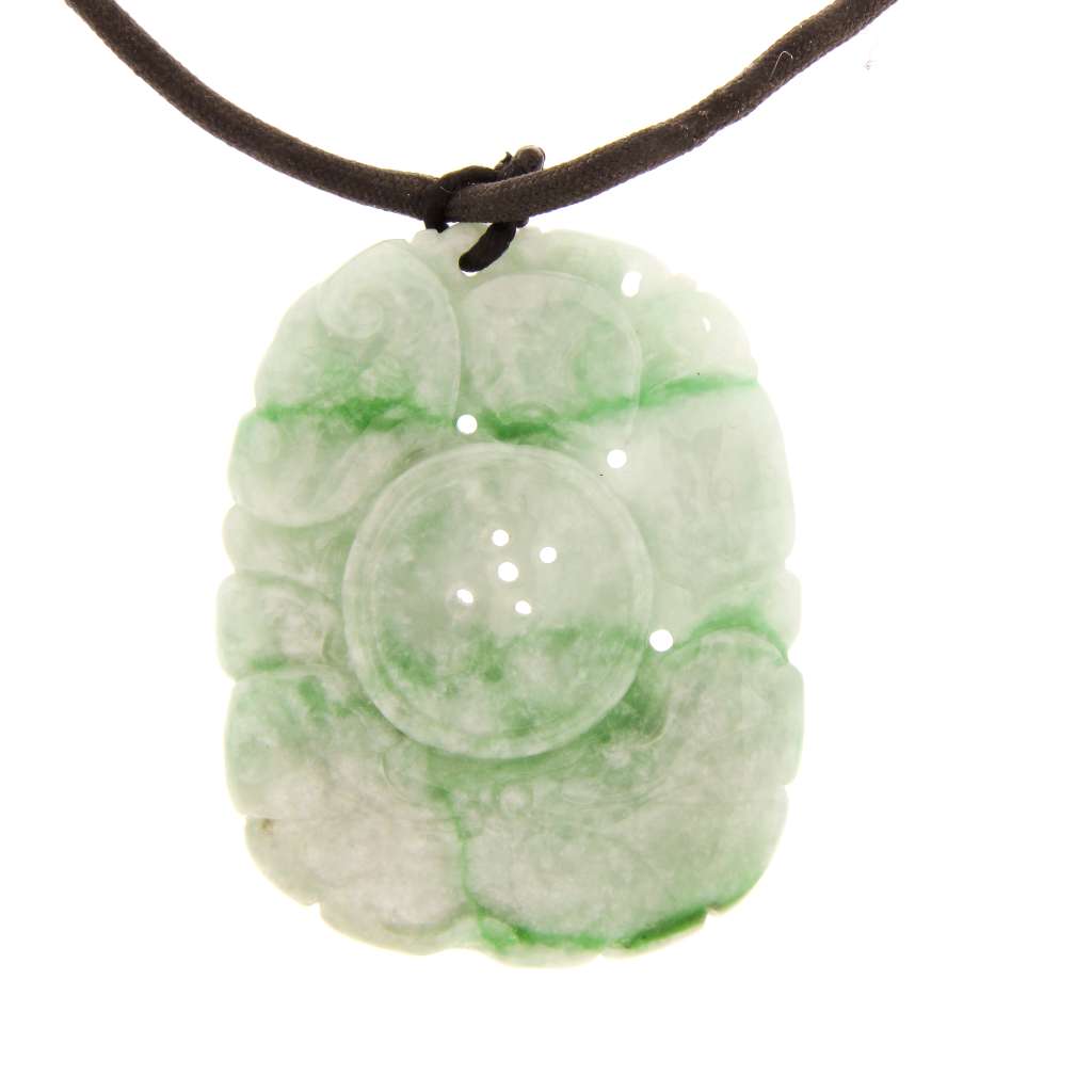 Side angle of jadeite jade pendant showing thickness and smooth polish with green and grey coloration