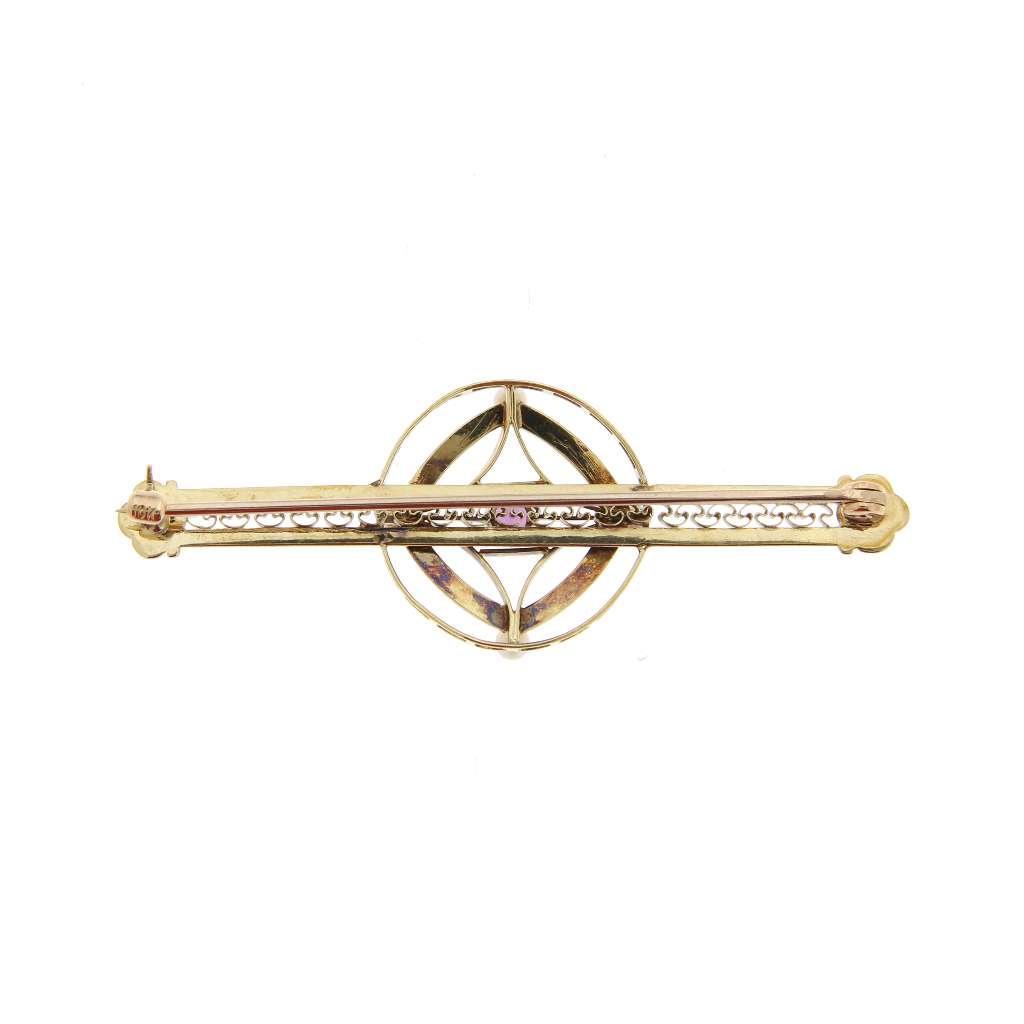 Elegant 14kt yellow gold brooch with purple amethyst and white seed pearls displayed on neutral background