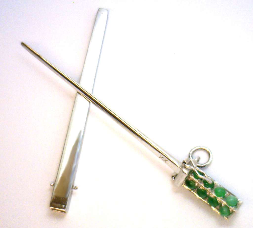 14kt white gold sword-style pendant with 16 round jade stones, close-up angle showing detailed setting and lustrous metal finish