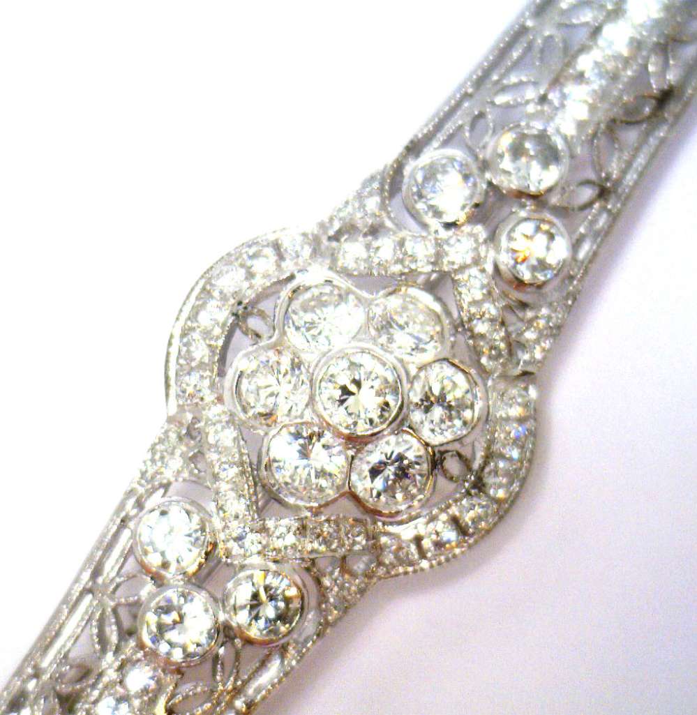 Side view of ladies white gold diamond brooch capturing the setting and overall weight impression