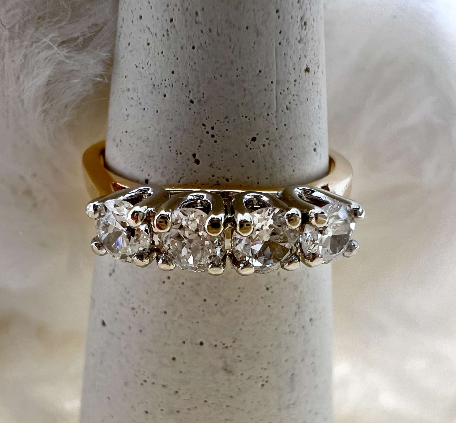 14kt yellow gold ring featuring four old European cut round diamonds in 4-claw setting, front angle