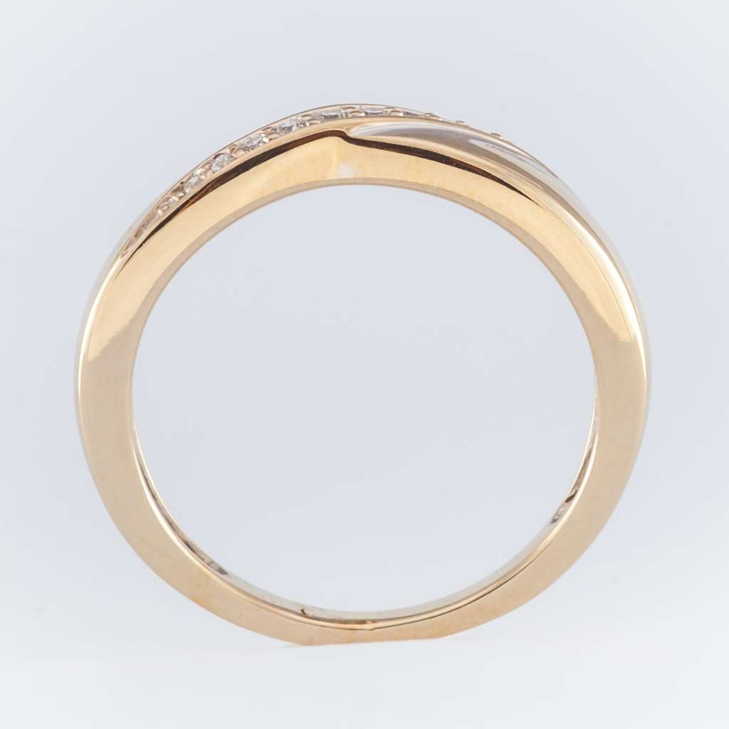 Side angle view of white gold diamond ring showing delicate band and sparkling diamonds