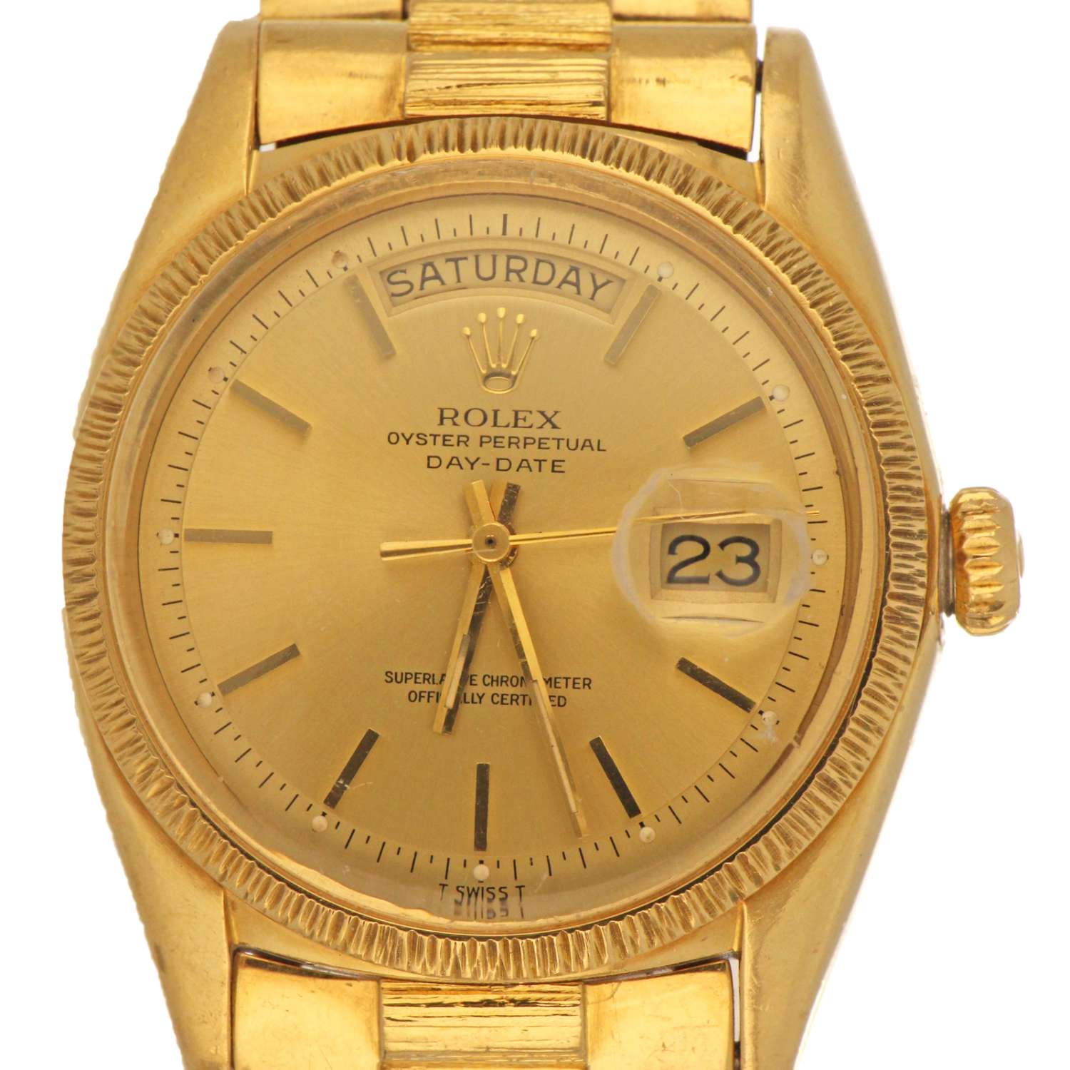 Close-up of the Rolex Day-Date champagne dial with day and date windows and gold hour markers