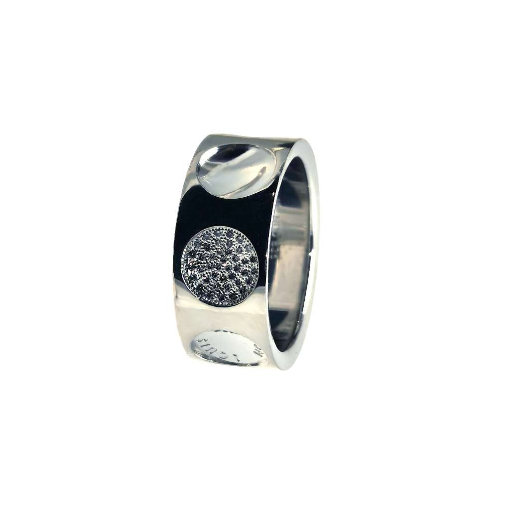 Close-up view of 18kt white gold Louis Vuitton Empreinte band featuring 41 round diamonds in bead setting, 10mm wide ring, polished finish