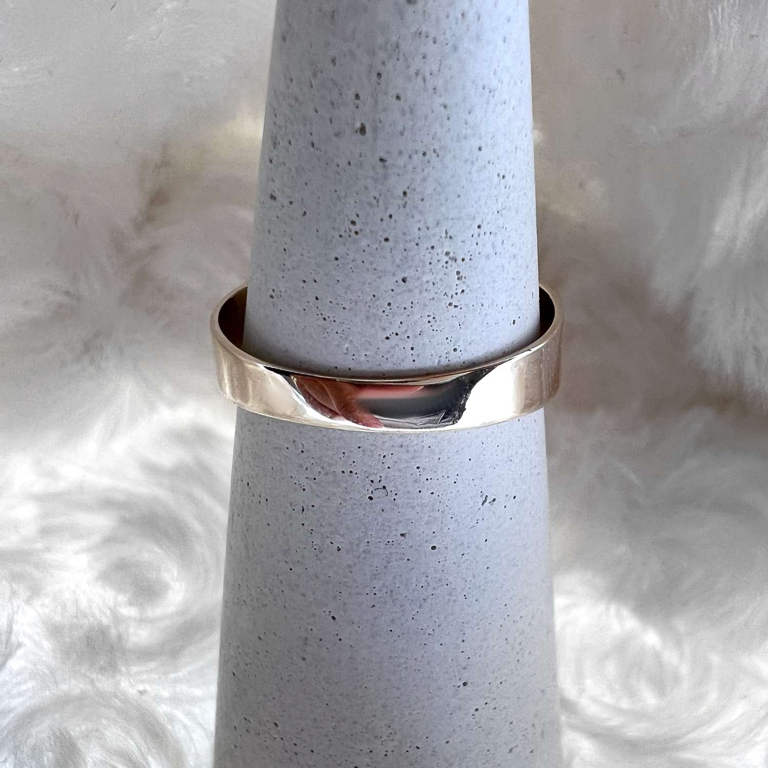 Side profile of 9kt yellow gold floral ring displaying intricate rose and jade leaf carvings