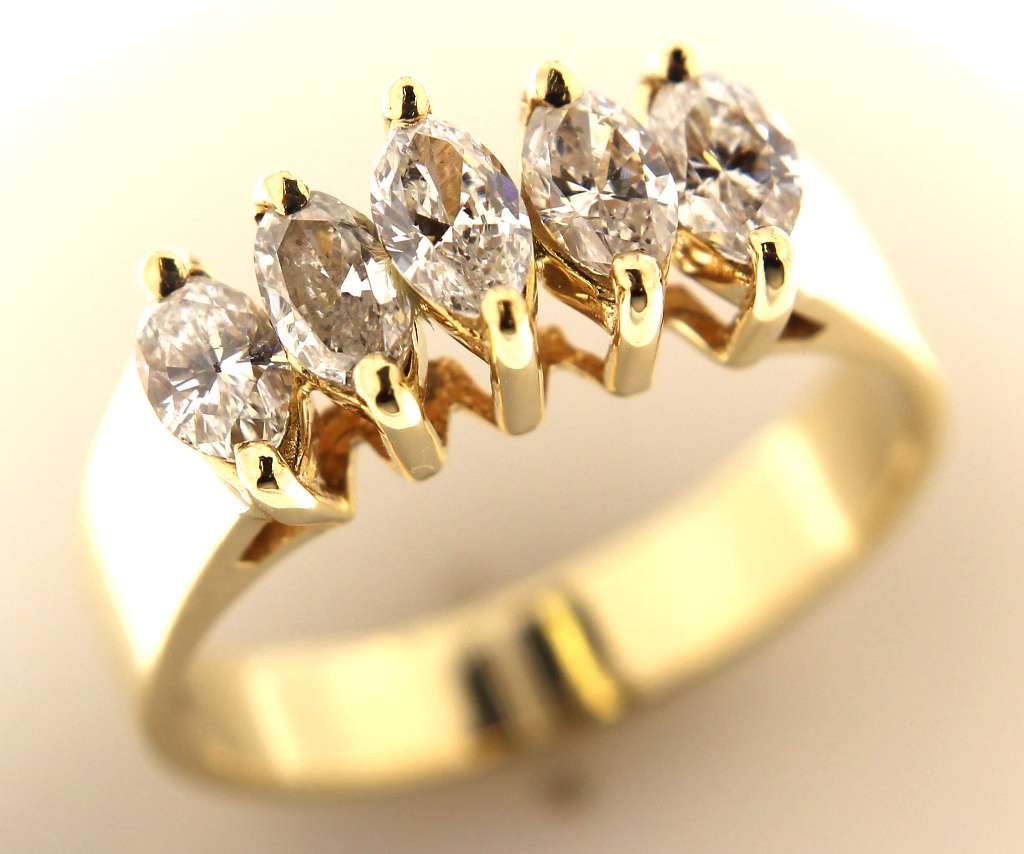 Close-up of 14kt yellow gold ring with five marquise-cut diamonds, claw setting, total 1.05cttw