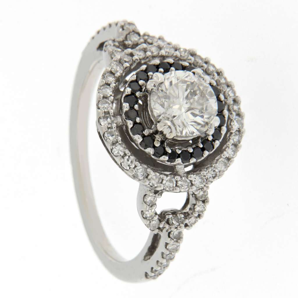 Top view of 14kt white gold diamond ring displaying central diamond and surrounding white and black diamonds