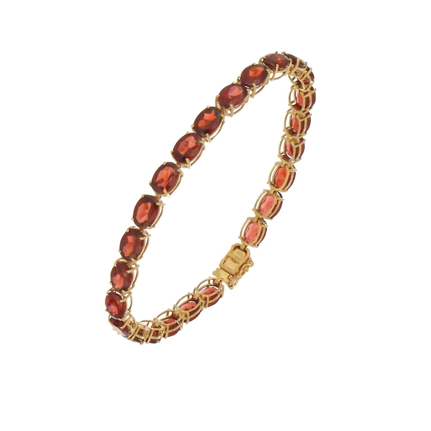 14kt yellow gold bracelet with 25 oval garnet stones set in claw setting, close-up on stones and gold links