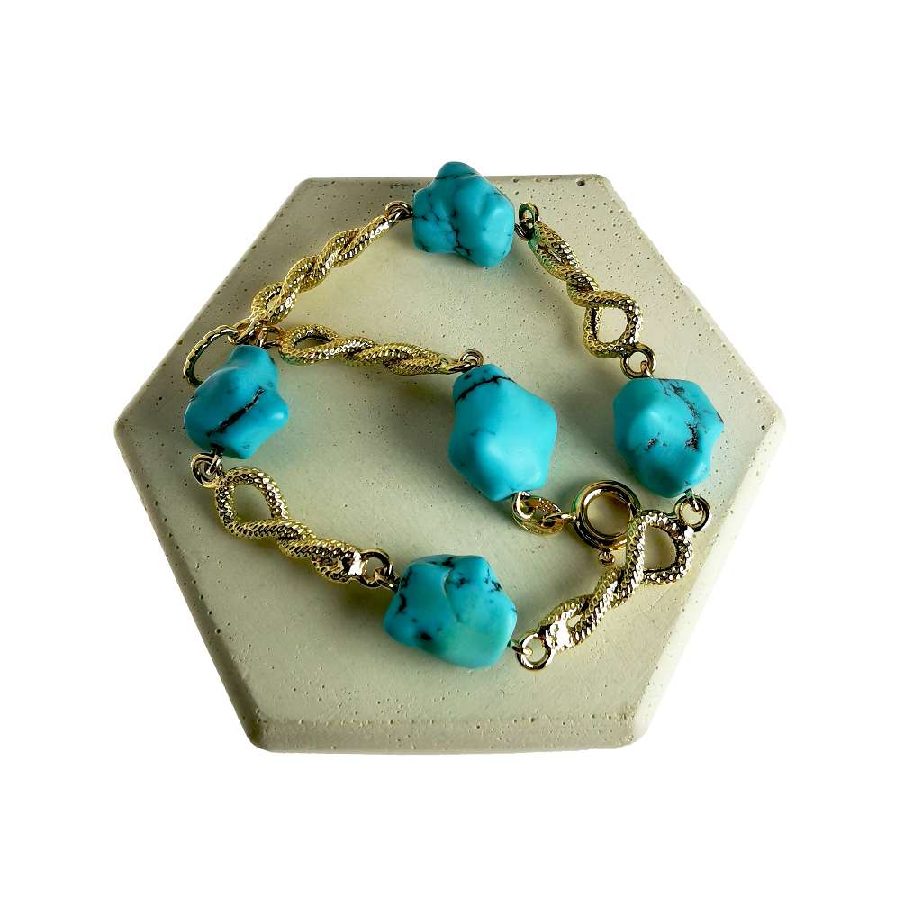 Detailed view of authentic 18kt yellow gold turquoise bracelet highlighting natural green turquoise stones and solid gold links