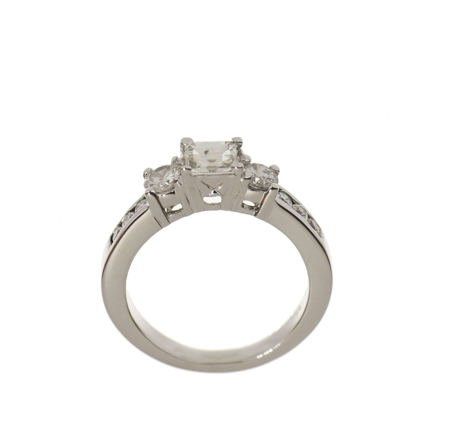 Detailed view of 14kt white gold engagement band with multiple diamonds in various cuts