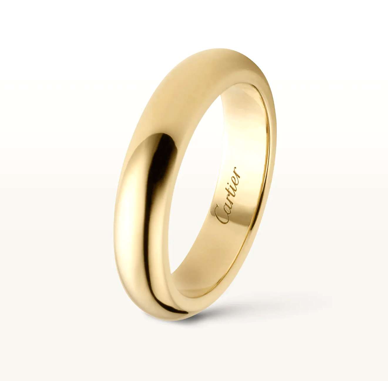 Side angle of 18kt yellow gold Cartier band highlighting 4mm width and luxurious shine