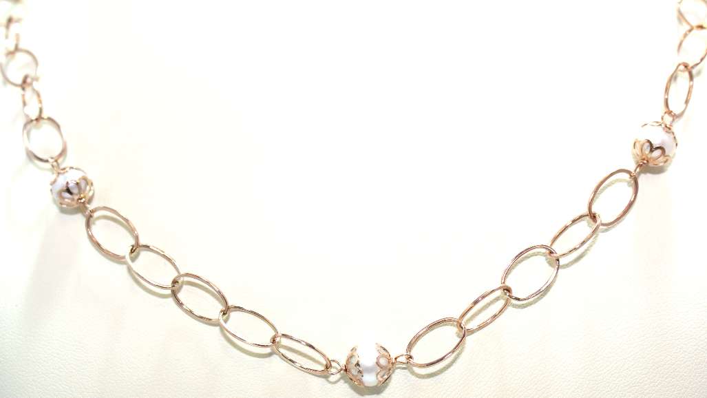 Elegant 14kt rose gold pearl necklace displayed on a white background, highlighting 22 inch length and polished finish