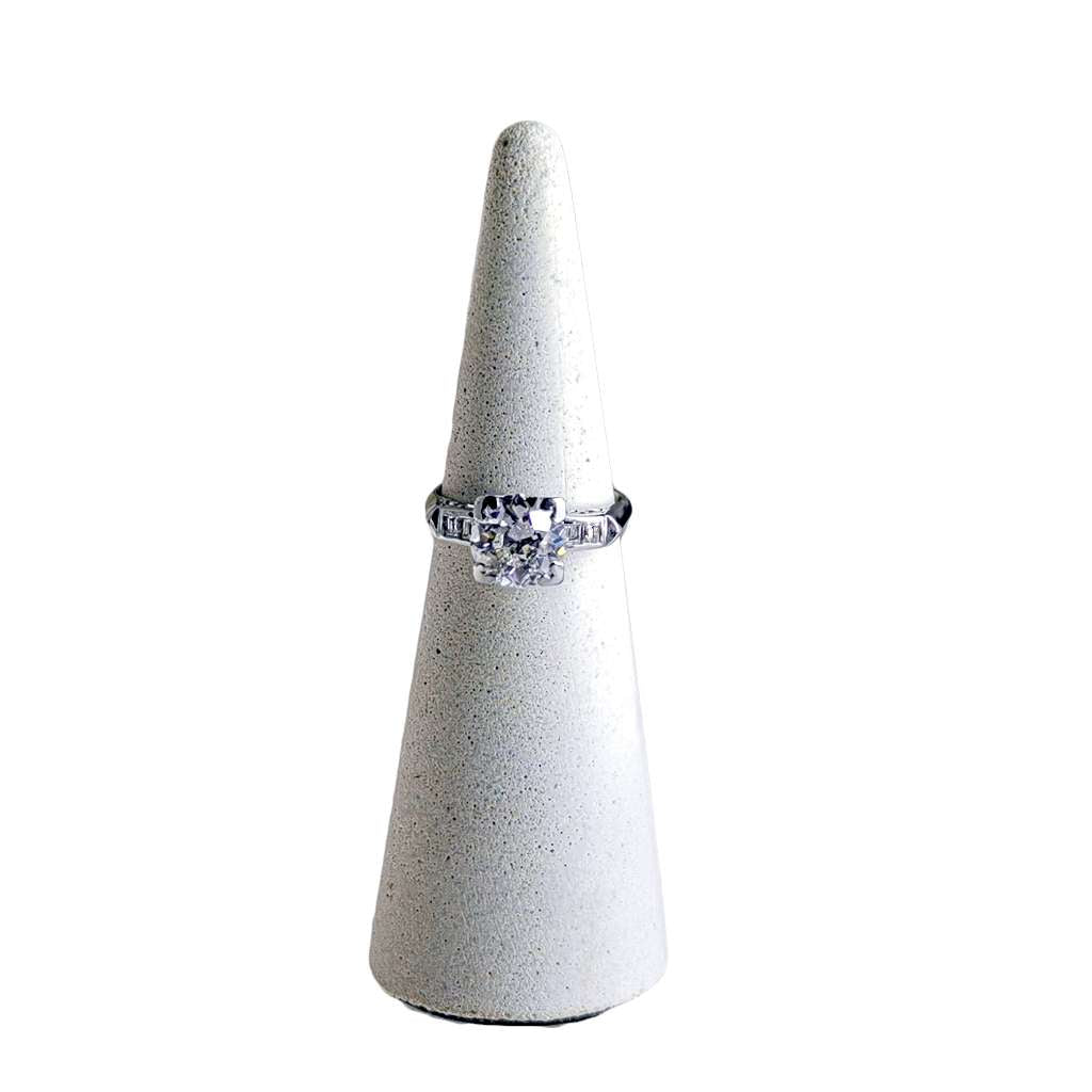 Side view of platinum diamond ring with baguette accents